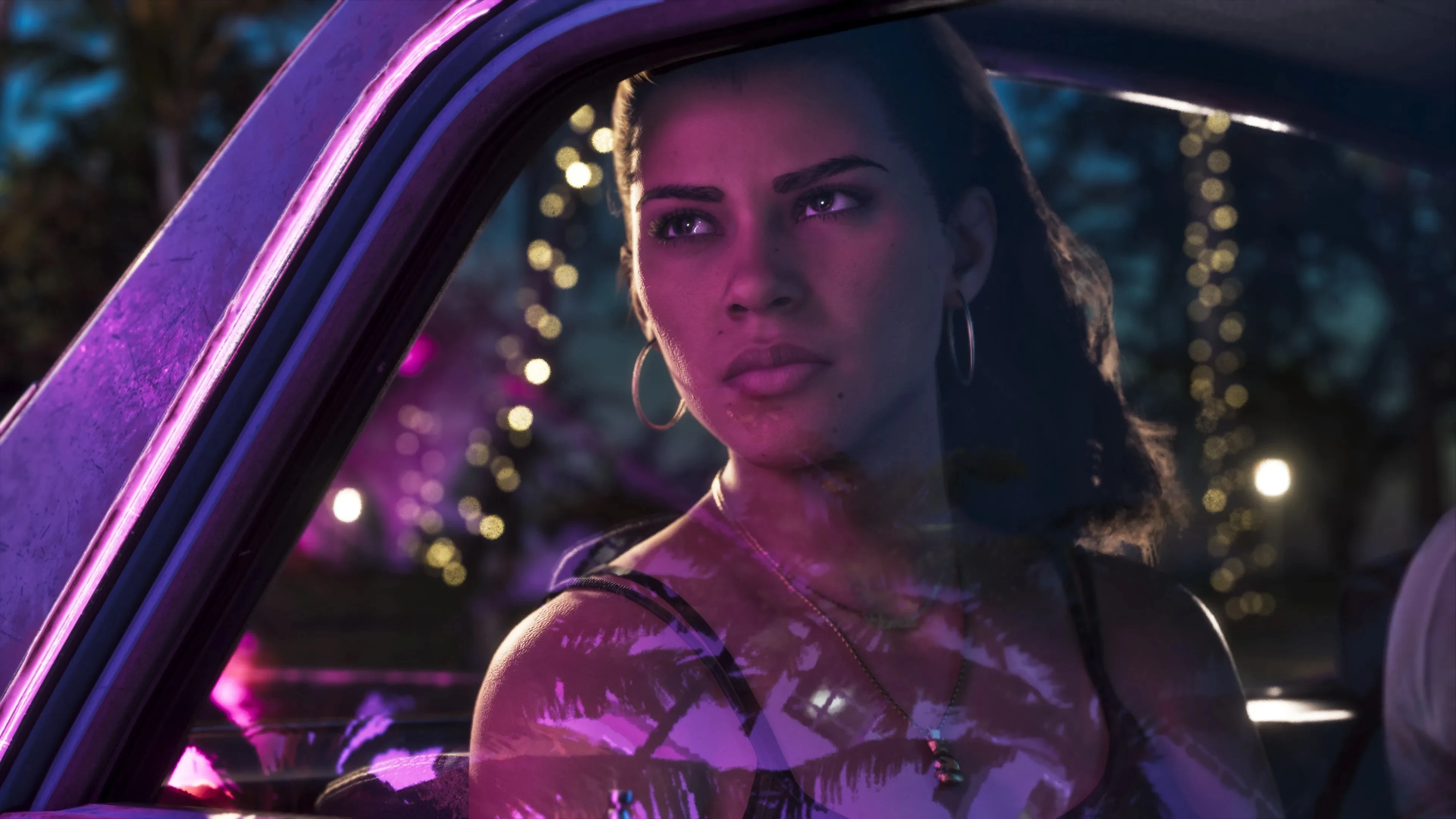 Lucia Caminos assise dans une voiture de nuit à Vice City